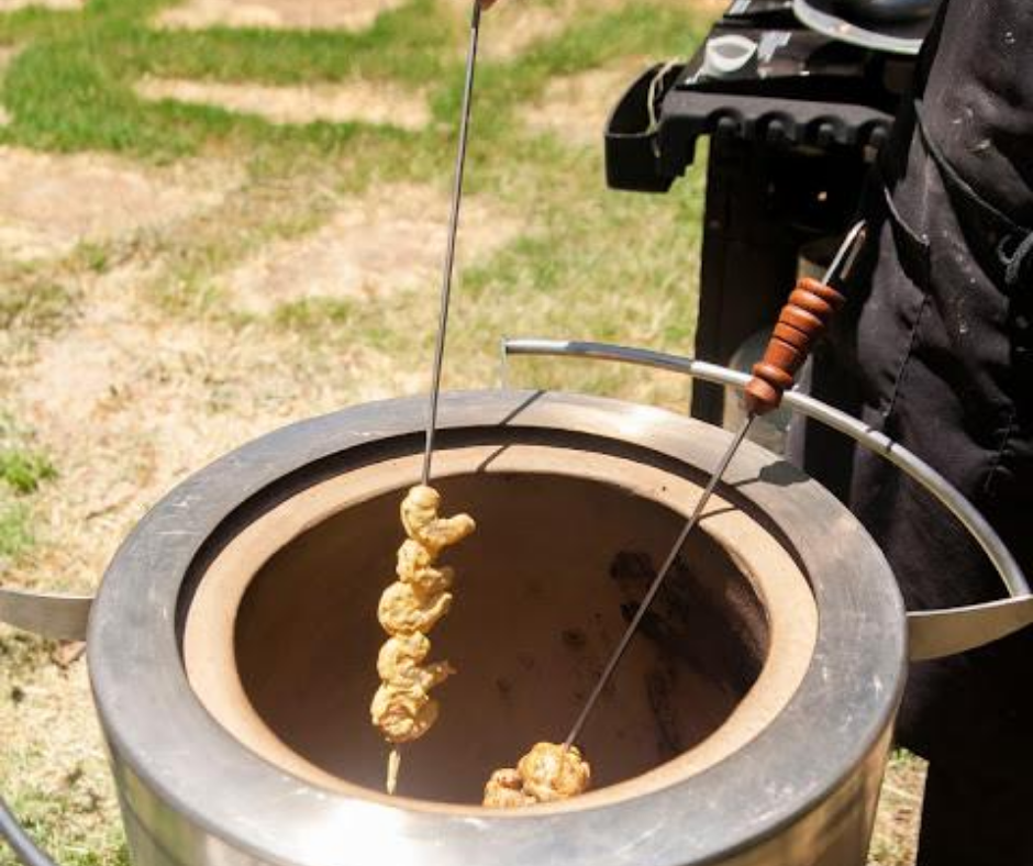 skewered shrimp being cooked in hōmdoor tandoor oven